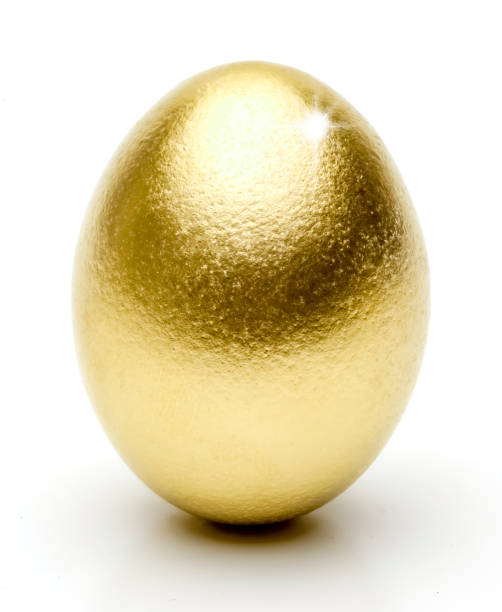 istock Shiny Golden Egg isolated against a white background 1470482206