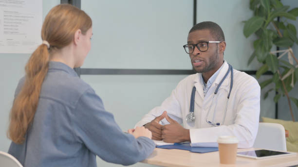 istock African Doctor Talking with Female Patient 1470482743