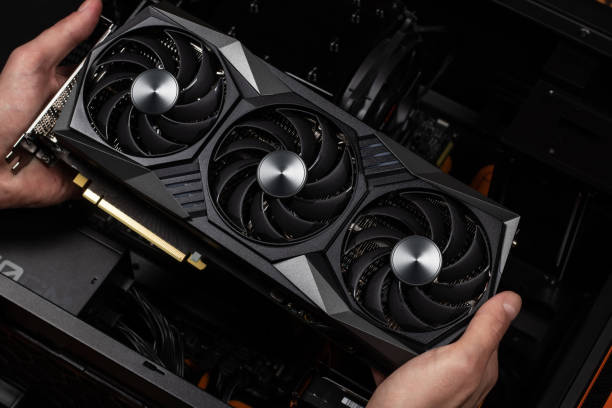 istock Installing video card in an open case of personal computer. 1470485012