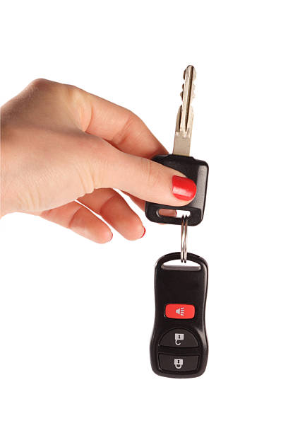 istock Woman's hand holding a key on white background 147048585
