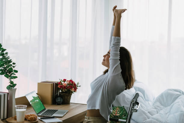 istock Caucasian woman stretch herself on desktop in Bedroom 1470486342
