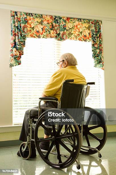 Elderly Man In Wheelchair By Window Stock Photo - Download Image Now - 70-79 Years, Adult, Adults Only