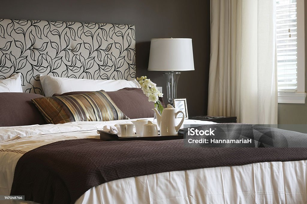 Master bedroom Master bedroom with a breakfast tray on the bed.  Bed - Furniture Stock Photo