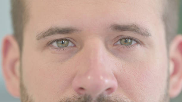 istock Close Up of Blinking Male Eyes 1470489583
