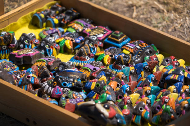 Colourful clay handcrafted Mexican whistles on tray