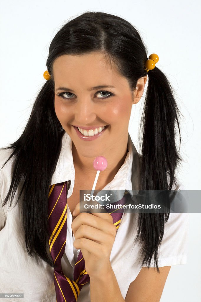Mulher vestida com Lollypop colegial - Foto de stock de Adulto royalty-free