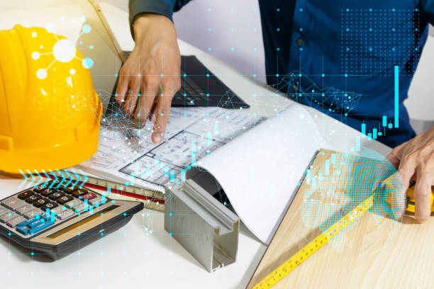 istock Profitability and growth of the construction business,Building projects, construction drawings and engineers 1470491106