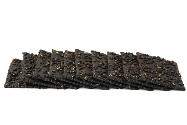 istock Crackers made of black sesame seeds on a white background 1470491244