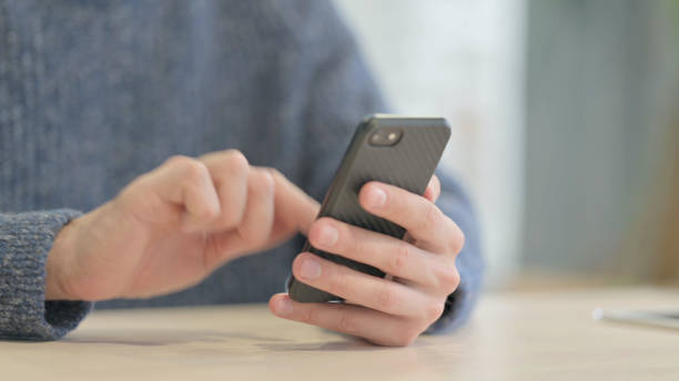 istock Close up of Man Using Smartphone 1470491366