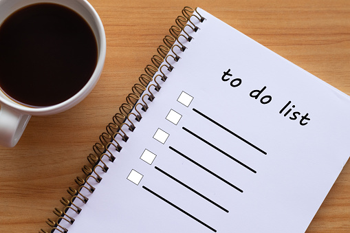 To-do list book and coffee cup