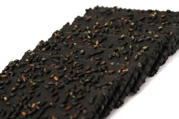 istock Crackers made of black sesame seeds on a white background 1470491691