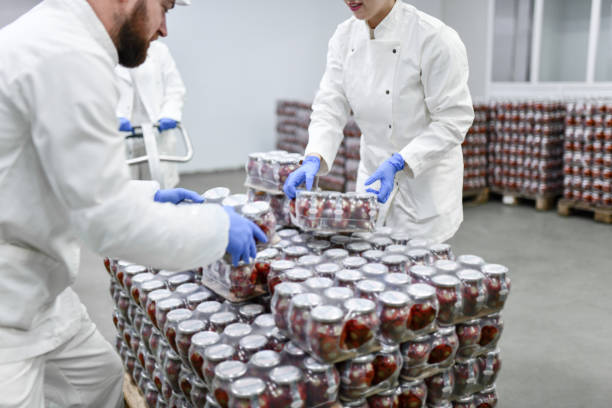 Teamwork Shown In Warehouse Stored With Stuffed Peppers Packaged Jars