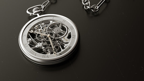 Metal pocket watch on the table