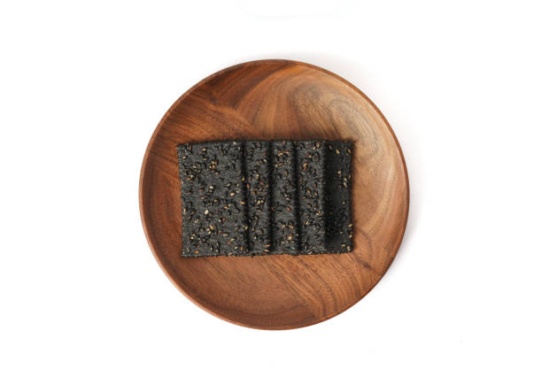 istock Crackers made of black sesame seeds on a white background 1470497769