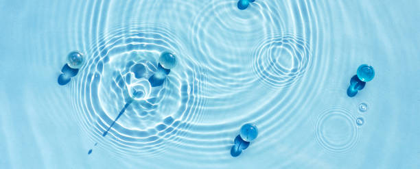 istock Texture of blue water with circles, ripples and transparent granules. 1470499151