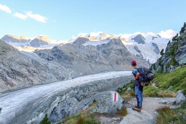 istock Mountain climber hiking path leading to glacier 1470499321