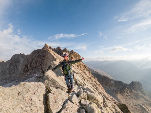 istock Mountain climber on mountain crest in summer 1470499362
