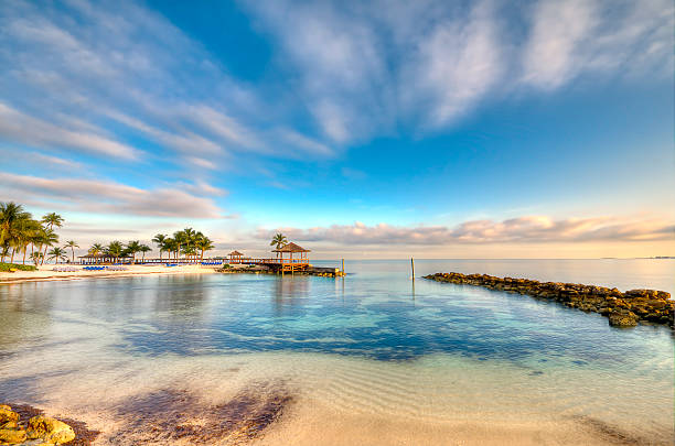 Morning in a Bahamas Beach View of beach and ocean in Nassau, Bahamas. caribbean stock pictures, royalty-free photos & images