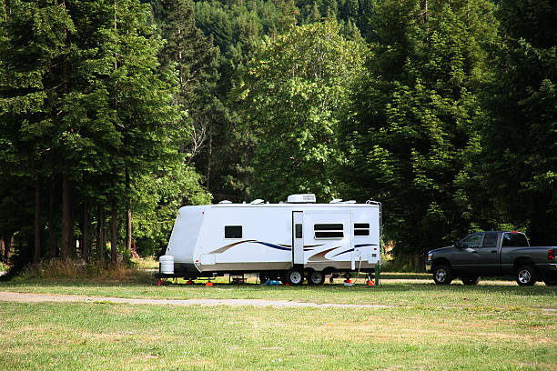 Travel Trailer with Slide Out Camping with RV in the Redwood Forest camper trailer photos stock pictures, royalty-free photos & images