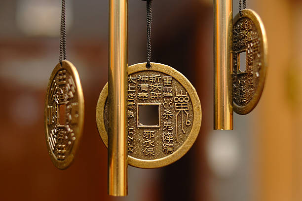 Old chinese bronze bell with hieroglyphs. stock photo