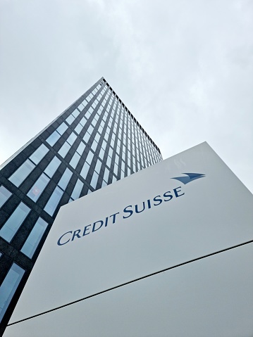 Credit Suissse  is a global investment bank and financial services firm founded (1856) and based in Switzerland. The image shows a large office building from the Credit Suisse in zurich Seebach, captured during winter season.