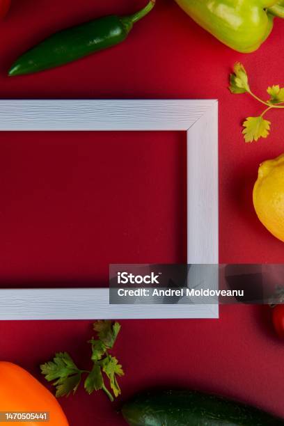 Top View Of Vegetables As Cucumber Pepper Coriander With Lemon And Frame On Bordo Background With Copy Space Stock Photo - Download Image Now