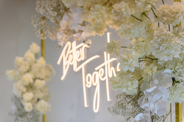 istock Better together text on photo-wall. Arch decorated flowers, greenery. Wedding reception. Celebration concept. Decorations in luxury ceremony in hall restaurant. Trendy decor for party in banquet area. 1470507716