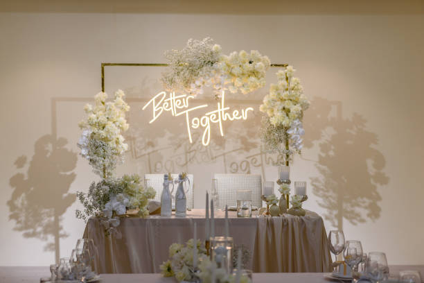 istock Wedding reception. Festive arch decorated composition flowers and candles in hall restaurant. Table newlyweds covered a tablecloth in banquet area on wedding party. Table setting. Celebration concept. 1470507724