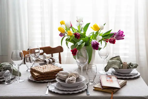 Table setting for passover with tulips flowers