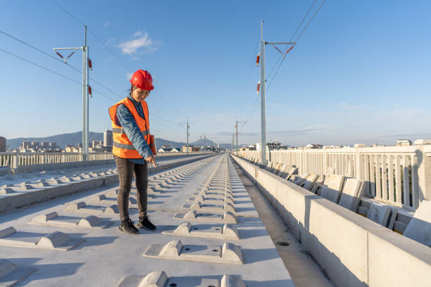 istock A female railway worker pointed out the construction problem on the unfinished railway site 1470511579