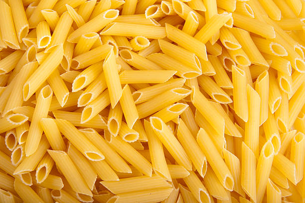 istock Bunch of yellow pasta as texture, pattern or background. 147051191