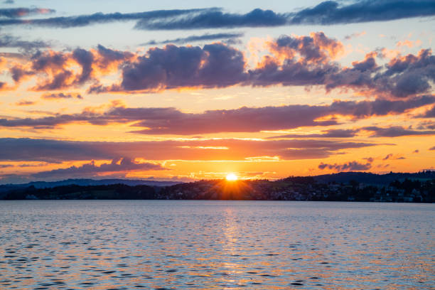 istock A sunset at the lake with purple red clouds 1470512293