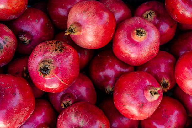 istock Fresh ripe pomegranates in the box 1470513226