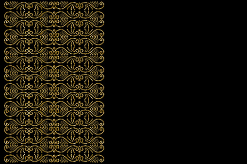 black background with patterned border of golden pearl beads and copy space