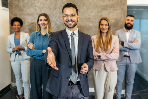 istock Successful group of business people at modern office looking at camera. 1470514507