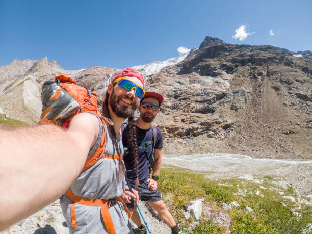 istock Two friends take a selfie while hiking up on a mountain 1470516208