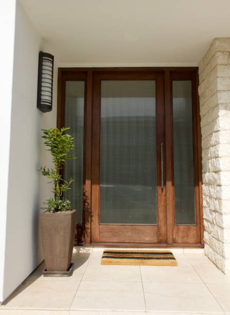 istock Modern three piece front door made with textured glass and hardwood 1470518541
