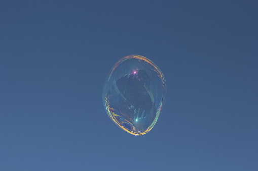 Soap bubble on a blue background