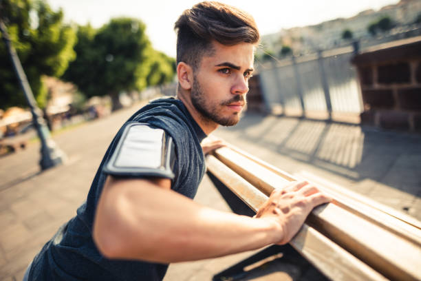 istock man doing stretching in the city 1470518876