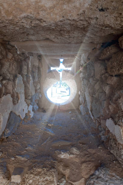 istock Rays of light passing through the small stone window of a medieval castle. 1470520745