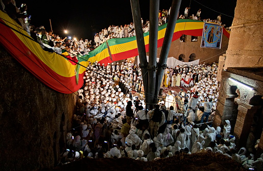 Lalibela, Ethiopia - January 06, 2023: Crowds of pilgrims gathered to attend Christmas service during night at \