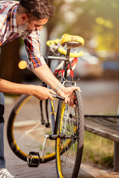 istock Handsome Man With Bike 1470522119