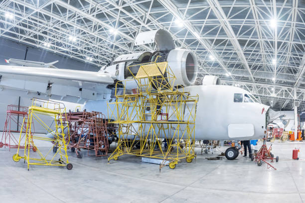 istock White transport aircraft in the hangar 1470524123