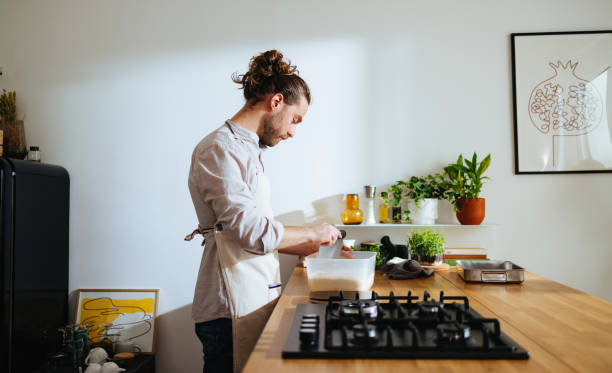 istock Handsome man preparing the dough in the kitchen 1470528015