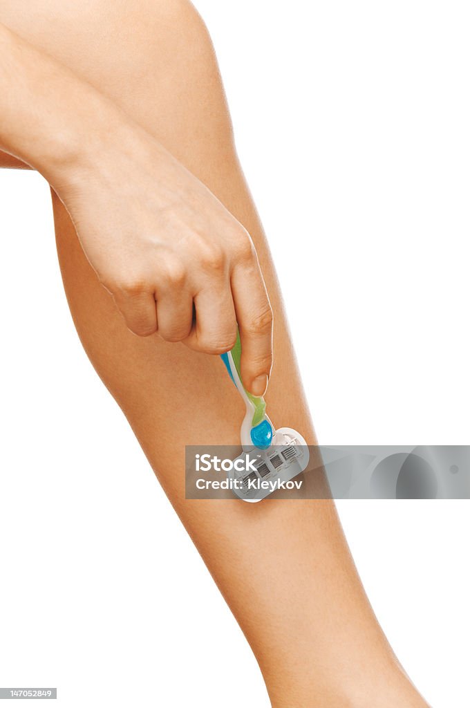 Женщина ноги для бритья - Стоковые фото Бритва роялти-фри