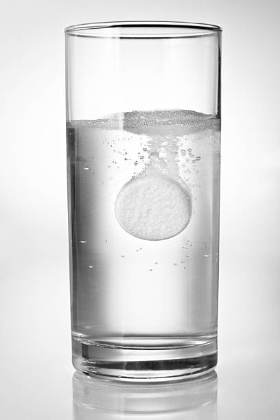 istock Fizzing tablet in glass of water 147052935
