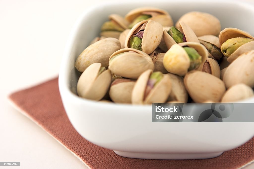 pistachio nut pistachio nut in bowl Bowl Stock Photo