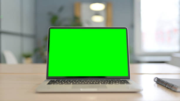 istock Laptop with Green Screen on Desk in Office 1470529834