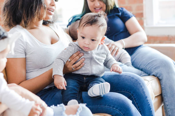 istock Unrecognizable moms hold babies and visit together 1470530513