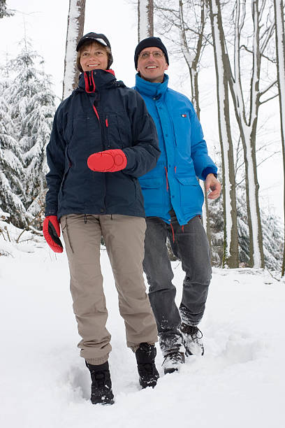 istock Mature couple walking in the snow 147053127